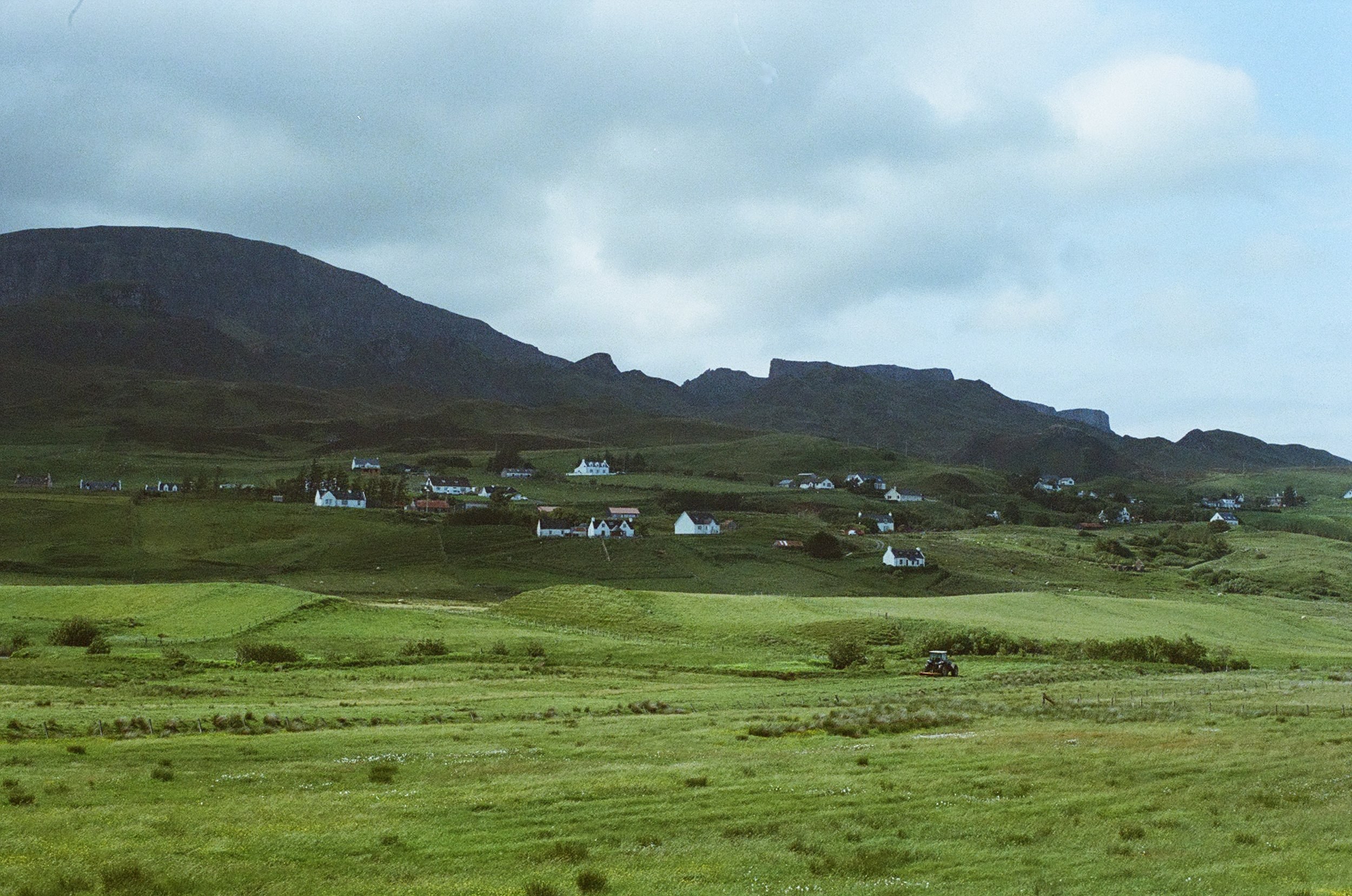 Sunny grassland being farmed in Skye on film